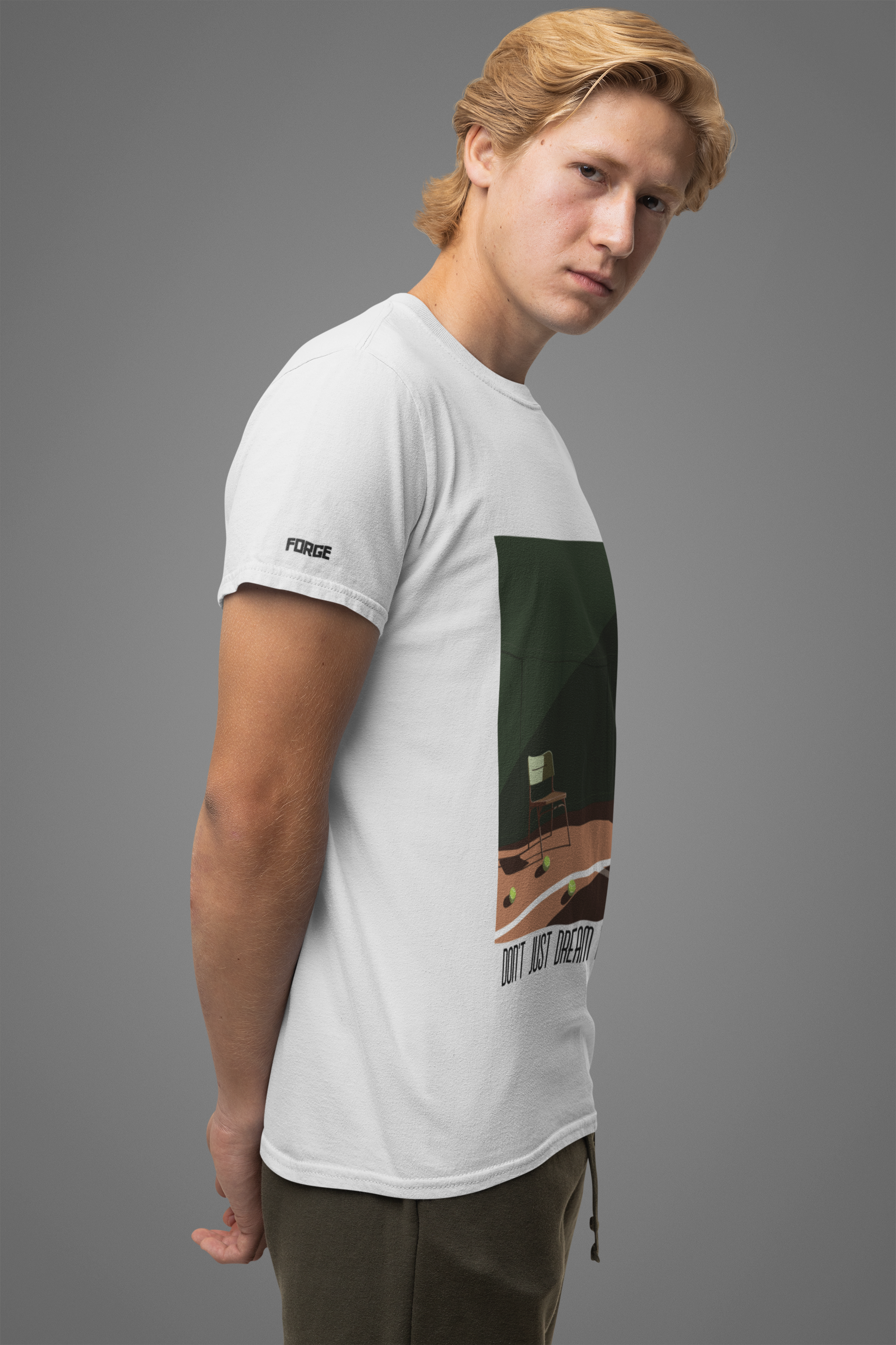 A while man posing sideways wearing a white Casual T-Shirt by  Forge Athletica.